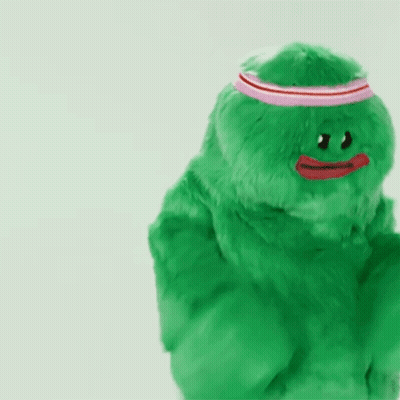 Green Stuffed Animal With Red Heart GIF