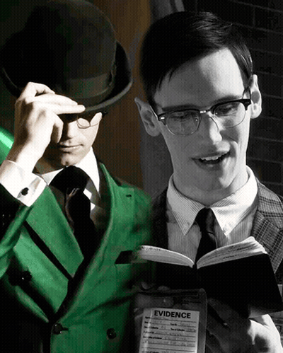 Green Suit Man Reading Book Beside Black And White Photo GIF
