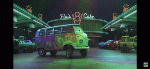 Green Van Parked In Front Of Fla 'S 8 Cafe GIF