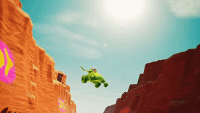 Green Vehicle Flying Over Desert GIF