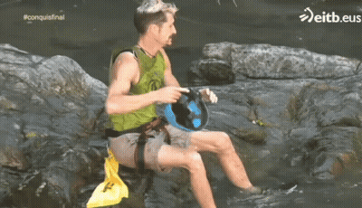 Green Vest Man On Rock In Water Eitb.eus GIF