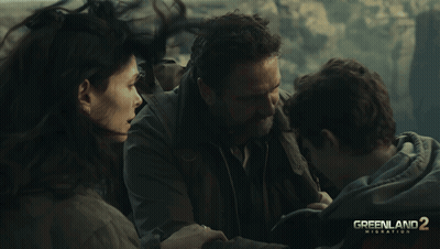 Greenland 2 Migration Movie Poster Three People Hugging GIF