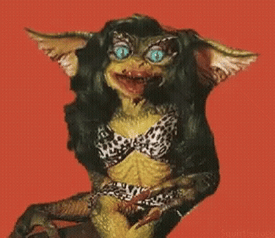 Gremlin In Bikini Sitting On Chair GIF