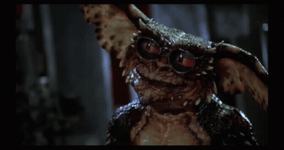 Gremlin Wearing Glasses Looking At Camera GIF