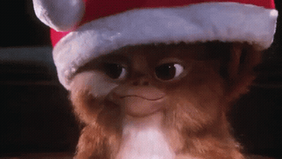 Gremlin Wearing Santa Hat Smiling GIF