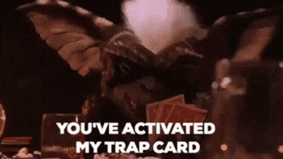 Gremlin With Cards Saying You've Activated My Trap Card GIF