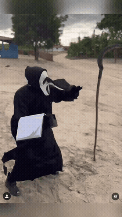 Grim Reaper Holding Book And Scythe GIF