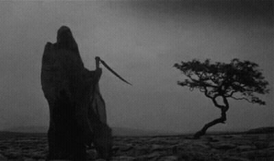 Grim Reaper Standing In Desert Holding Scythe GIF