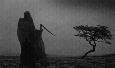 Grim Reaper With Scythe In Desert GIF
