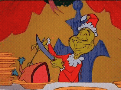 Grinch Cutting Sausage GIF