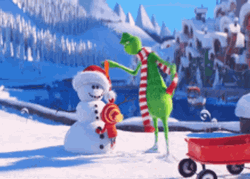 Grinch Smile Putting Carrot Nose In Snowman GIF