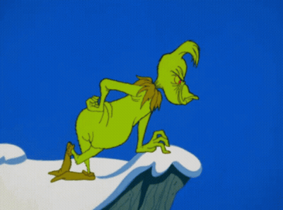 Grinch Standing On Snow Covered Cliff GIF