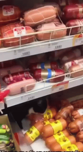 Grocery Shelf Filled With Sausages And Meats GIF