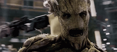 Groot Holding Gun And Looking GIF
