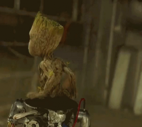 Groot Sitting Down And Waving GIF