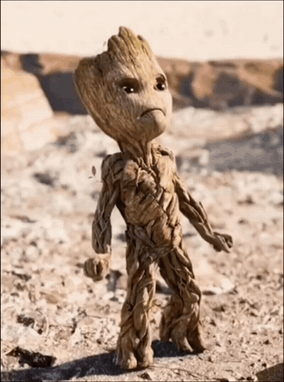 Groot Sitting On Rock Holding Box GIF