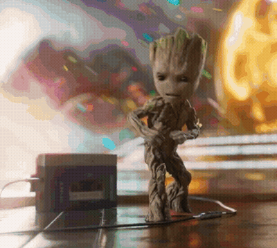 Groot Statue On Wooden Table GIF