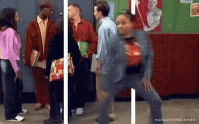 Group And Dancing Woman In Hallway GIF