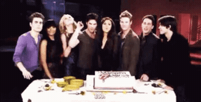 Group Around Cake Saying Vampire Diaries