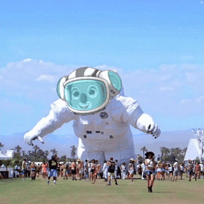 Group Around Giant Inflatable Astronaut Balloon GIF