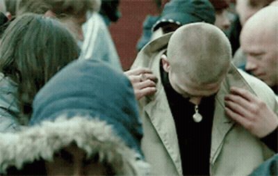 Group Around Man With Necklace GIF