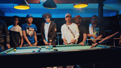 Group Around Pool Table With Man Holding Cue GIF