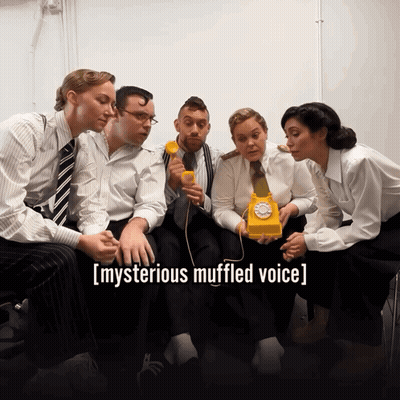 Group Around Yellow Telephone Mysterious Muffled Voice GIF