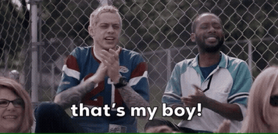 Group At Chain Link Fence Saying That's My Boy GIF