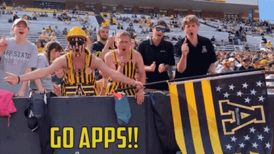 Group Behind Banner Saying Go Apps GIF
