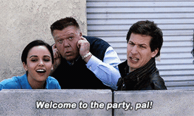 Group Behind Concrete Wall Saying Welcome To The Party Pal GIF