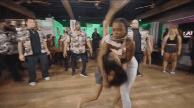 Group Dancing As Man Holds Woman GIF