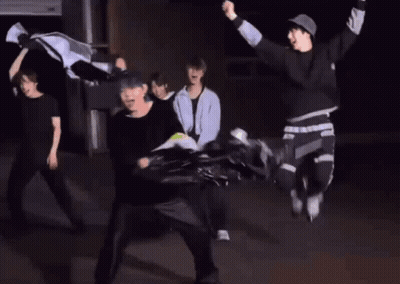 Group Dancing In Dark Room While Man Throws Frisbee GIF