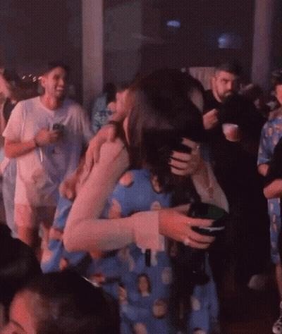 Group Dancing In Dark Room Woman Holding Wine GIF