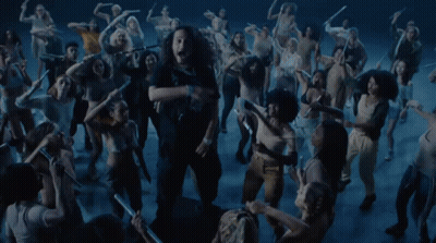 Group Dancing In Dark Room Woman Sticking Tongue Out GIF