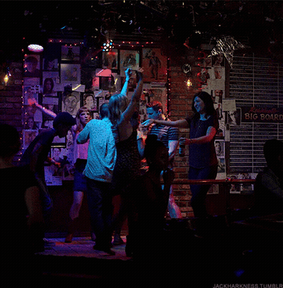 Group Dancing In Front Of Big Board GIF