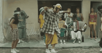 Group Dancing In Front Of Building With Accordion Player GIF