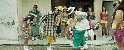 Group Dancing In Front Of Building With Accordion Player GIF