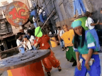 Group Dancing In Front Of Building With Letter C GIF