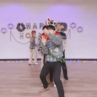 Group Dancing In Front Of Happy Wall GIF
