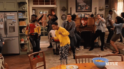 Group Dancing in Front of Netflix Sign