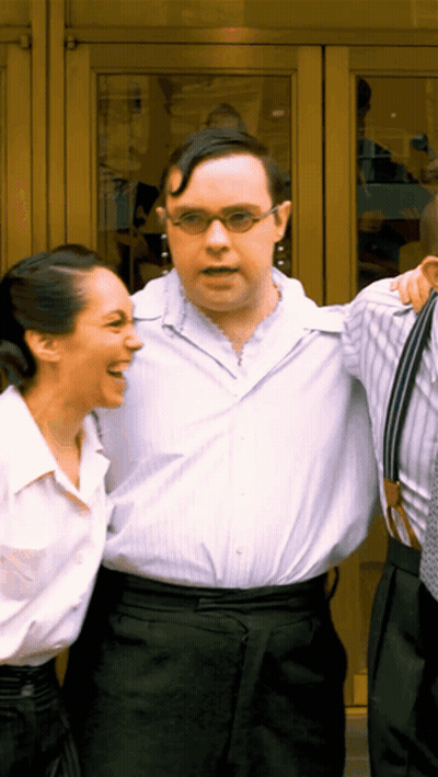 Group Dancing In Front Of Official London Theatre Sign GIF