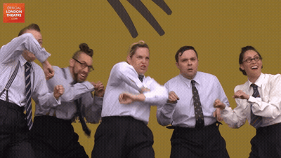 Group Dancing In Front Of Official London Theatre Sign GIF