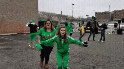 Group Dancing In Parking Lot With Irish Sign GIF