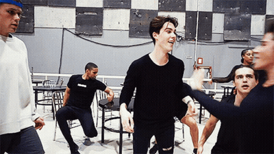 Group Dancing In Room With Fire Exit Sign GIF