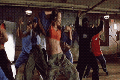 Group Dancing In Room With Fire Sign GIF