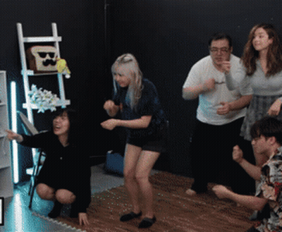 Group Dancing In Room With Ladder And Toast GIF