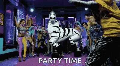 Group Dancing In Room With Zebra Costume Saying Party Time GIF