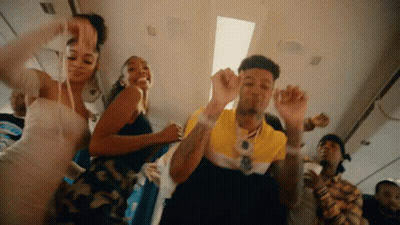 Group Dancing On Plane With Man In Yellow Shirt GIF