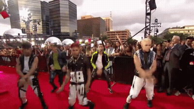 Group Dancing On Red Carpet With Number 28 Shirt GIF