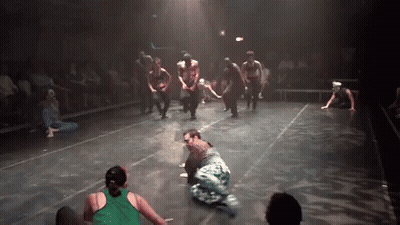 Group Dancing On Stage One In Green Shirt GIF
